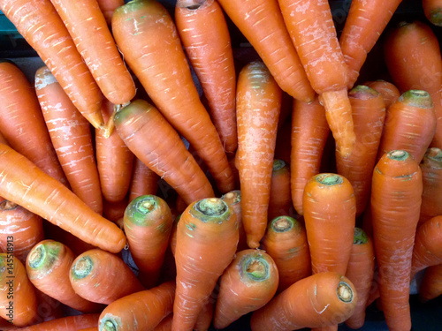 many fresh carots for a background texture