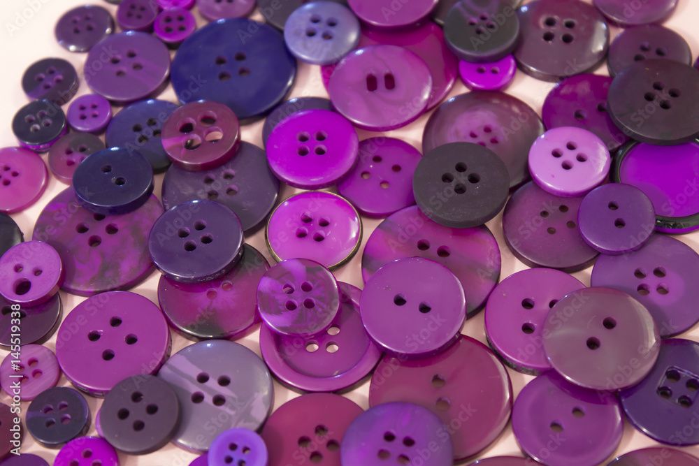 Purple sewing buttons background Purple sewing buttons background