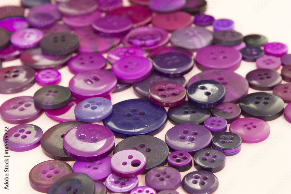 Purple sewing buttons background Purple sewing buttons background