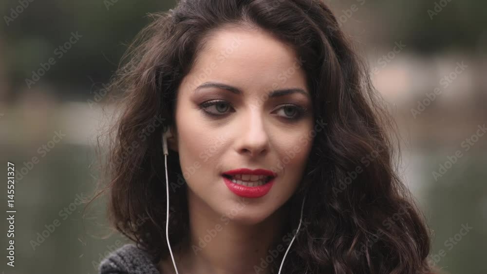 close up on Brunette serious and nervous on the phone at the park close up on Brunette serious and nervous on the phone at the park