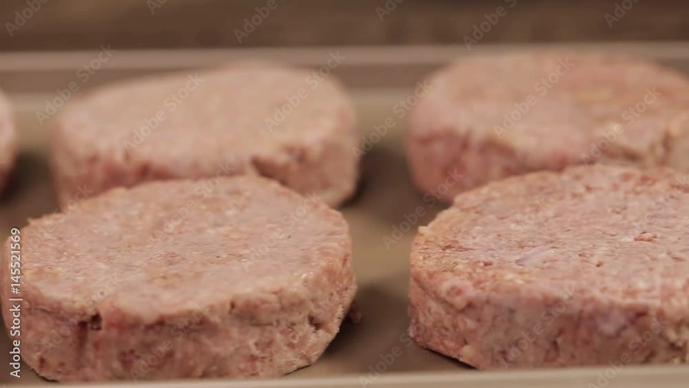 Meat Patty - Raw Beef Patties On Tray - Slider - Left To Right Meat Patty - Raw Beef Patties On Tray - Slider - Left To Right