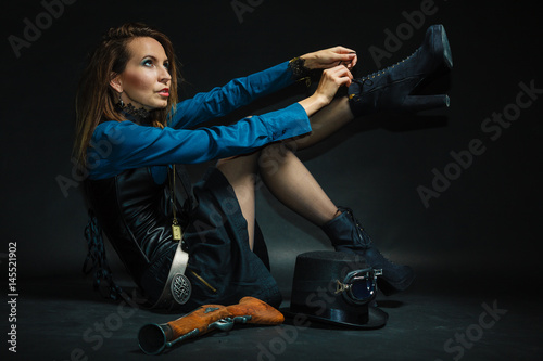 Vintage girl fixing footwear.