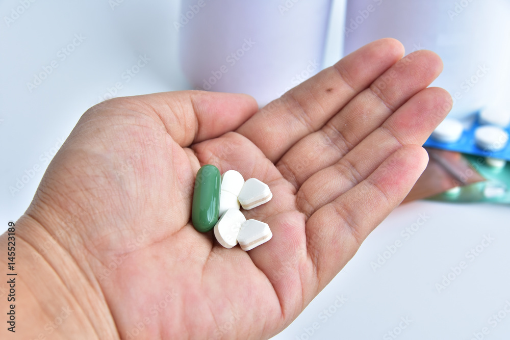 hand holding medicine. hand holding medicine.