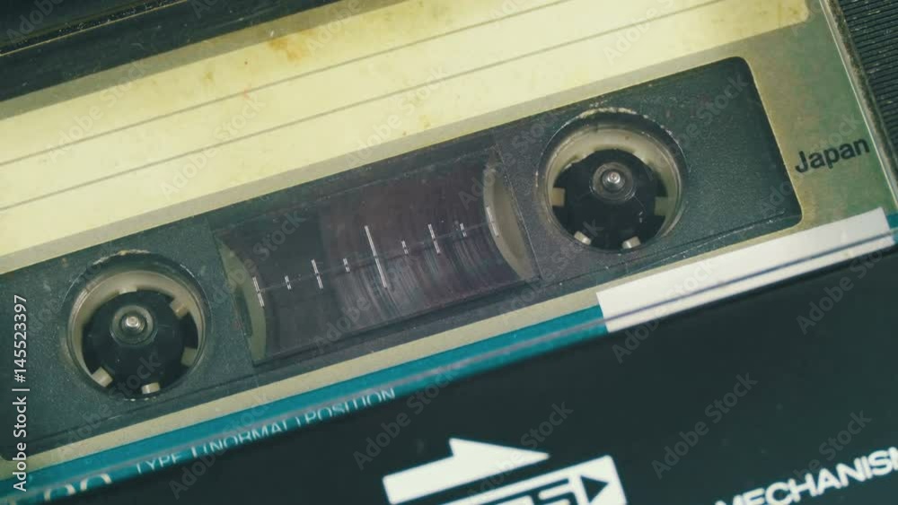 Insert an Audio Cassette into a Cassette Player and Playback. Vintage