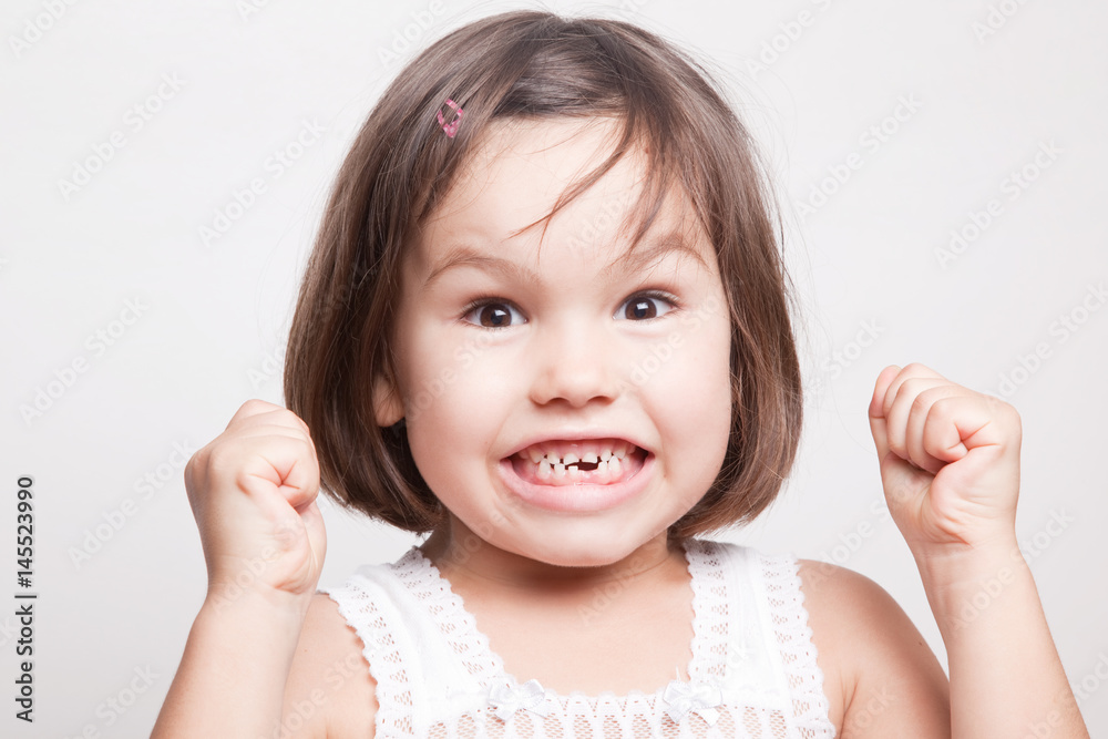 The child dropped the first milk tooth The child dropped the first milk tooth