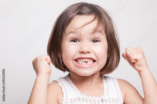 The child dropped the first milk tooth