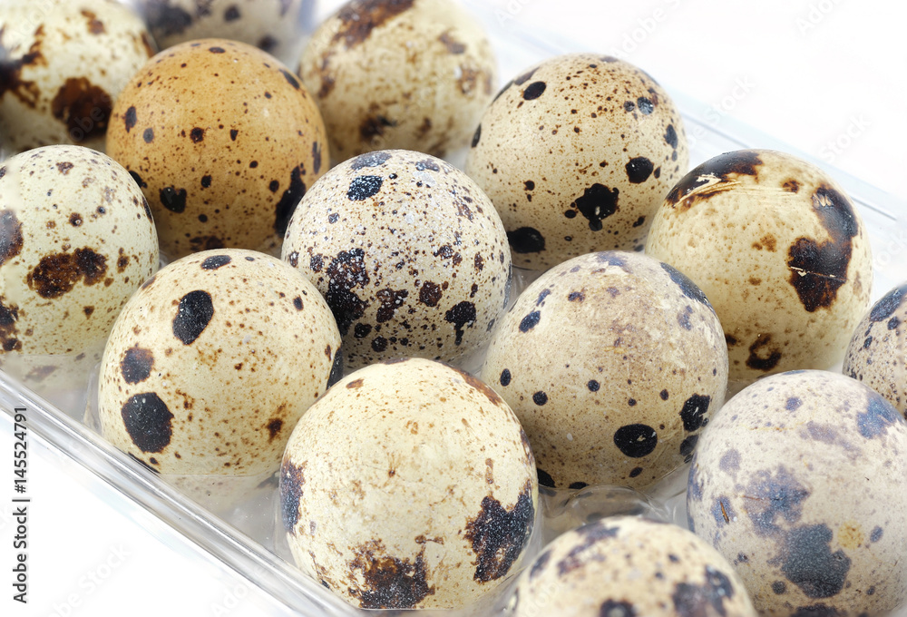 fresh quail eggs isolated on white background