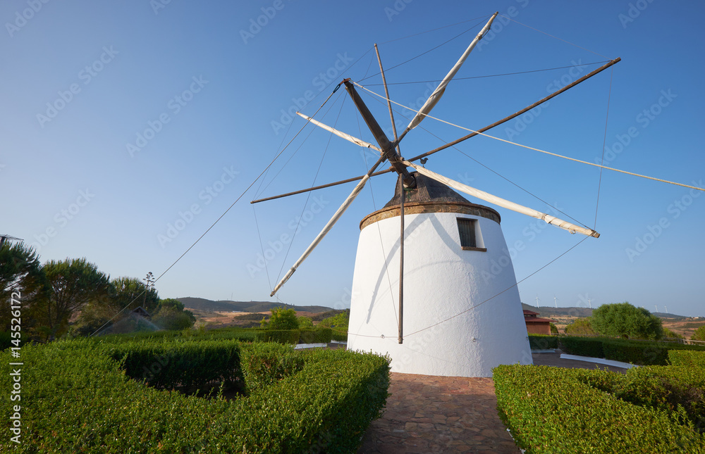 Old traditional windmill on the hill near El Granado in Andalusia, Spain