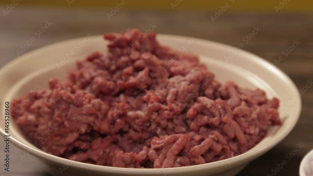 Minced Meat - Minced Beef In A White Bowl - Focus Pull Minced Meat - Minced Beef In A White Bowl - Focus Pull