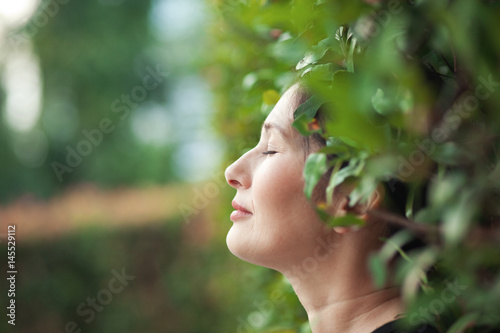 Woman in green garden 