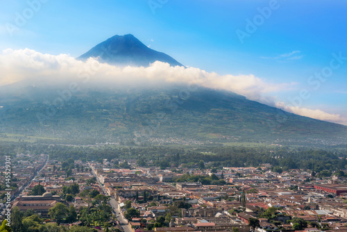 Panoramic view from Cerro de la Cruz on the city of Antigua, Guatemala and Volcano De Agua in the background.