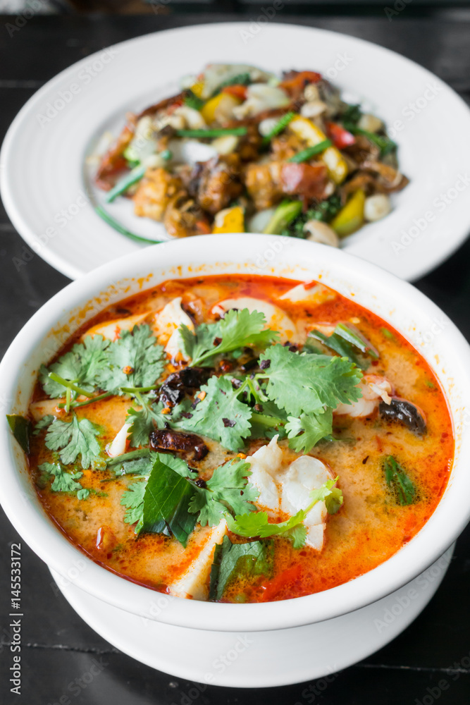 Thai spicy and sour soup with prawn (Tom Yum Goong), popular Thai cuisine Thai spicy and sour soup with prawn (Tom Yum Goong), popular Thai cuisine
