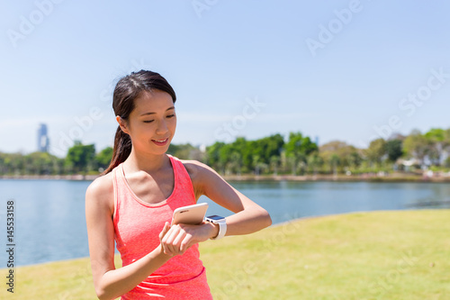 Photography Woman using smart watch and ready for running
