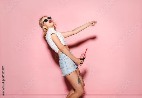 Woman drinking coke and having fun