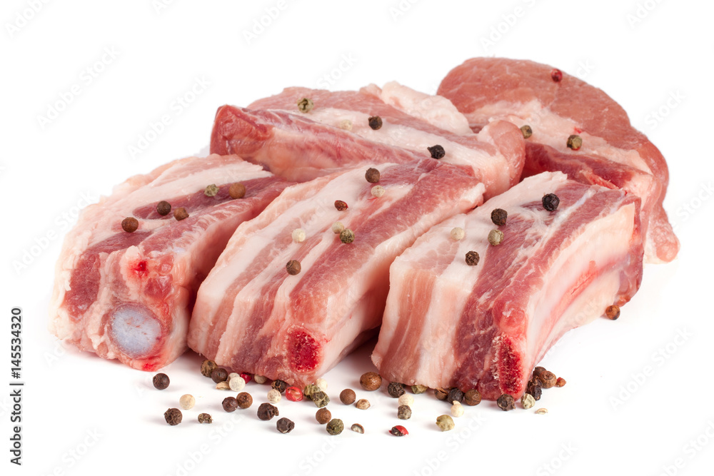 pieces of pork with peppercorn isolated on white background