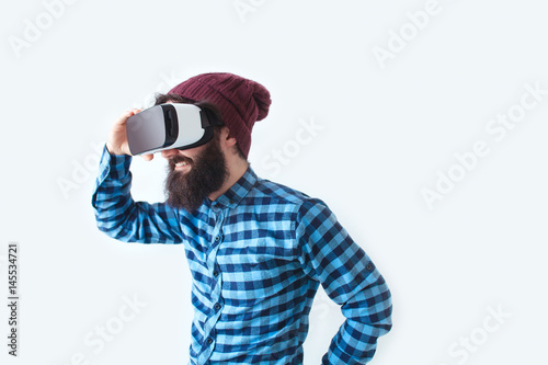 Smiling man using VR headset