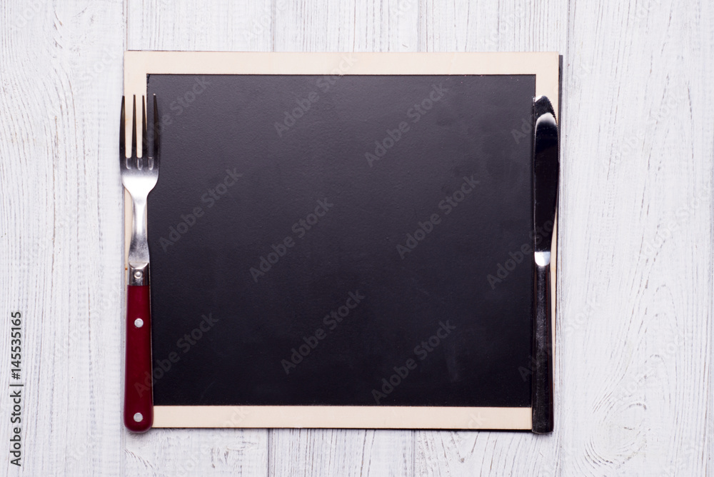Obraz premium menu blackboard with knife and fork