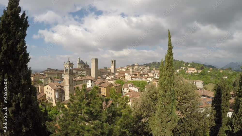 Bergamo - Old city (Città Alta), Italy. Landscape on the city center, the group of old towers from the old fortress Bergamo - Old city (Città Alta), Italy. Landscape on the city center, the group of old towers from the old fortress