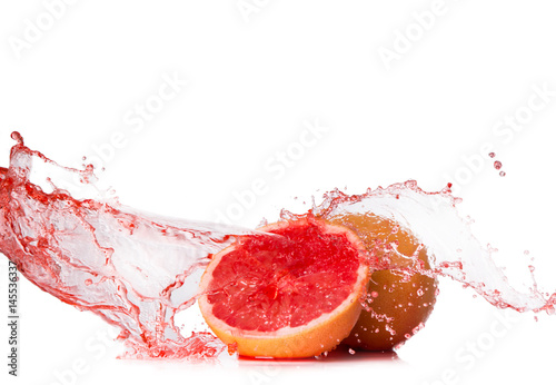 Water splash with grapefruits and lime isolated on white background. Splash motion with fruits. Abstract object 
