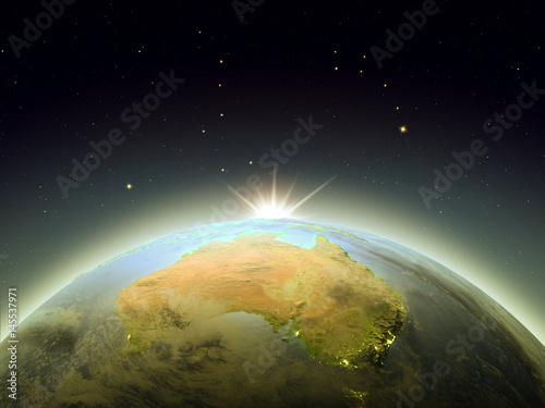 Fototapeta Naklejka Na Ścianę i Meble -  Sunrise above Australia from space