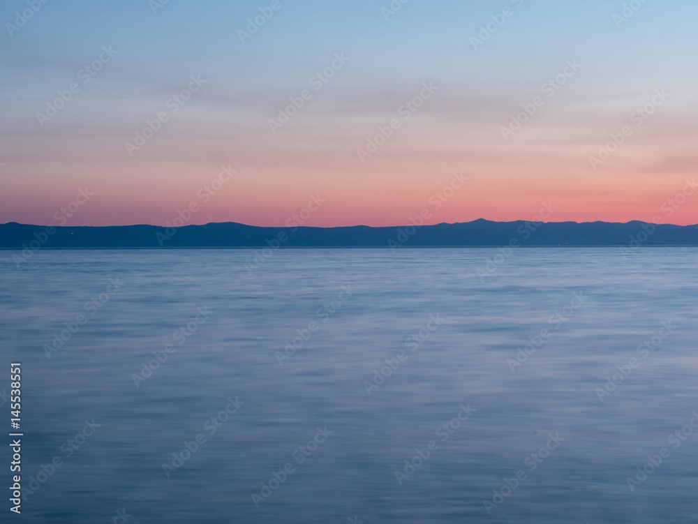 Blue sea at sunset long exposure