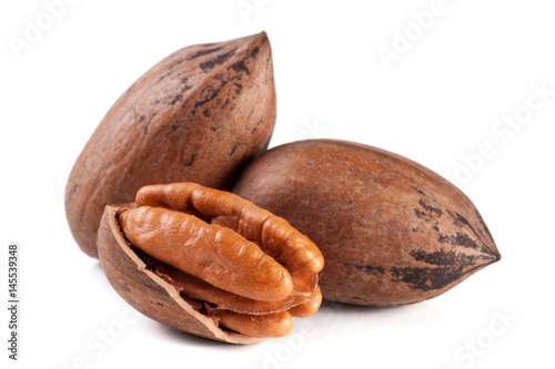 Three pecan nuts isolated on white background photo