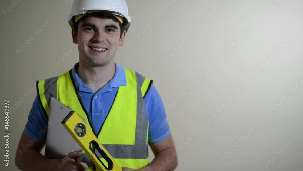 Builder Wearing Safety Helmet Walks Into Focus And Smiles