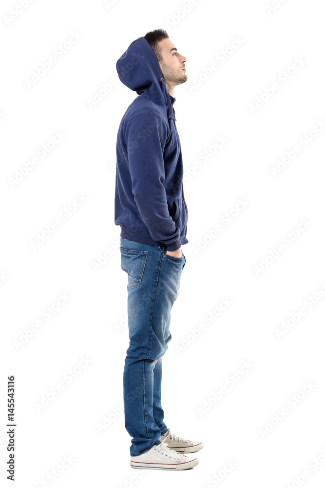 Side view of handsome confident cool young guy with hoodie on head looking  up. Full body length portrait isolated over white studio background. Stock  Photo | Adobe Stock