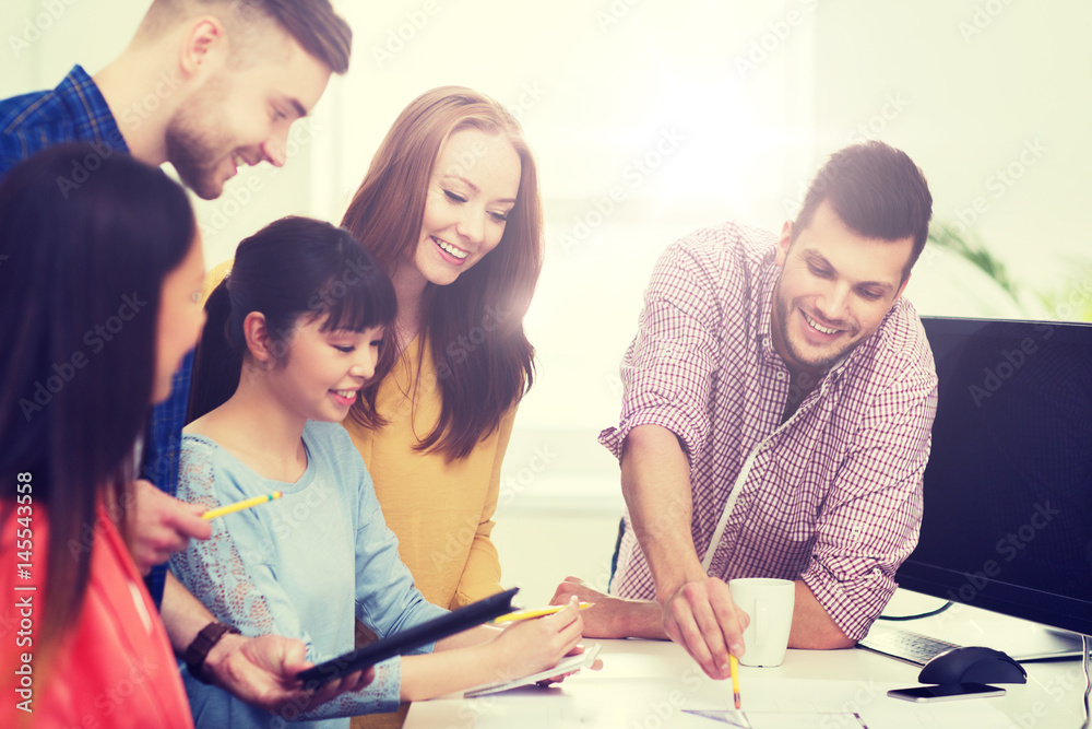 happy creative team or students working at office happy creative team or students working at office