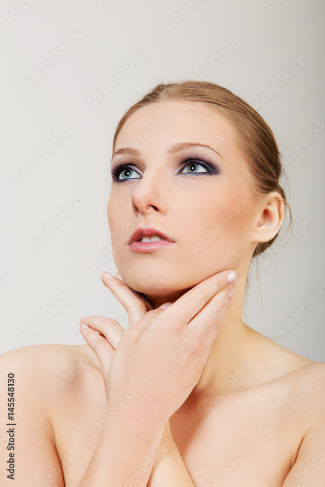 Attractive blonde topless woman with dark eye make up Attractive blonde topless woman with dark eye make up