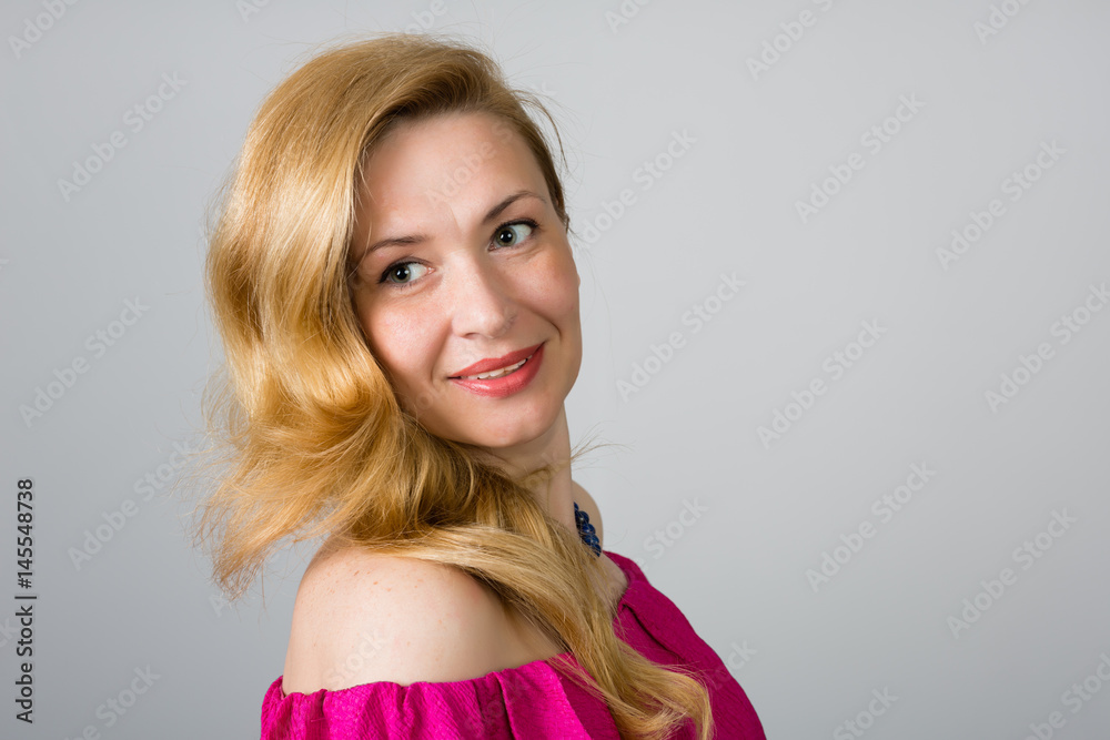 Portrait of a 39 year old woman in pink dress Portrait of a 39 year old woman in pink dress