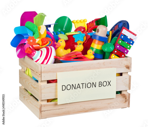 Toys donations box isolated on white background photo