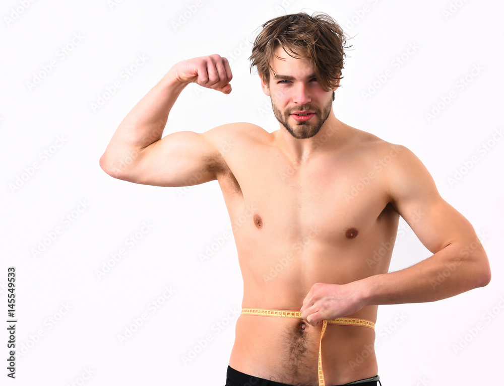 Caucasian sexy young macho uses measuring tape Caucasian sexy young macho uses measuring tape