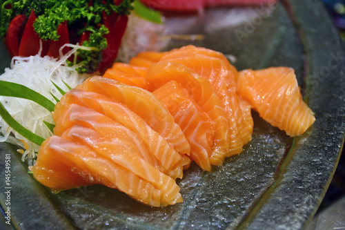 Selective focus point Raw fresh Salmon sashimi - japanese food style