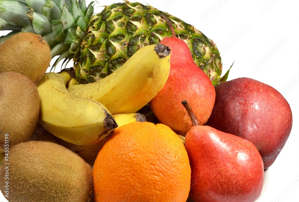 Tropical fruits closeup - bananas, pineapple, kiwi, oranges, pears, apples. Isolated on white background