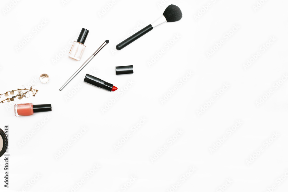Makeup brushes, nail polish and lipstick on white background. Copy space, flat lay, top view. Beauty blog theme Makeup brushes, nail polish and lipstick on white background. Copy space, flat lay, top view. Beauty blog theme