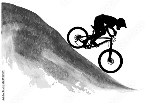 Silhouette of a cyclist riding a mountain bike