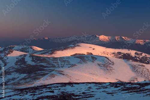 Snowy hills in morning light. Carpathians, Ukraine