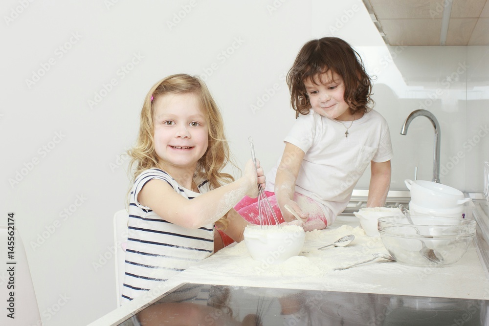 happy family funny kids are preparing the dough, bake cookies in the kitchen happy family funny kids are preparing the dough, bake cookies in the kitchen