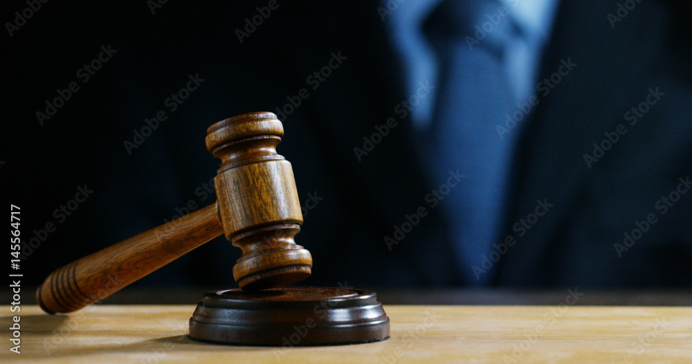 hand shake, auction scene of lawyers or notaries with gavel judge for the insurance compensation or criminal cases. concept of law and lawyer, judiciary and legislature applied to the democratic law. hand shake, auction scene of lawyers or notaries with gavel judge for the insurance compensation or criminal cases. concept of law and lawyer, judiciary and legislature applied to the democratic law.