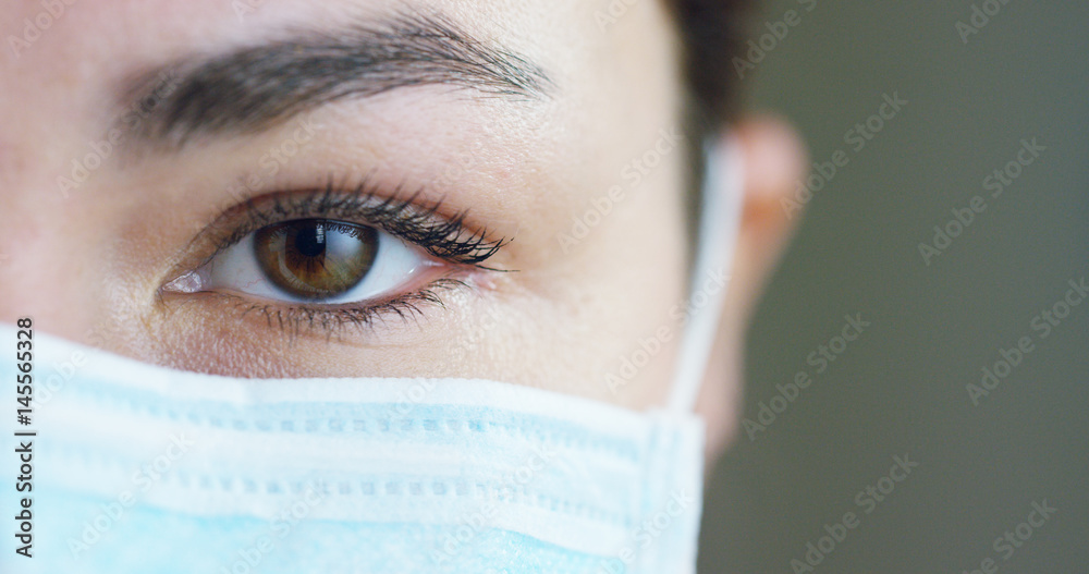 close up portrait of a woman surgeon or doctor with mask ready for operation in hospital or clinic. close up portrait of a woman surgeon or doctor with mask ready for operation in hospital or clinic.