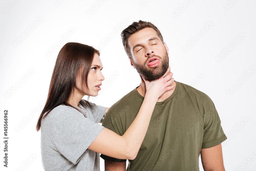 Offended young loving couple swear isolated Offended young loving couple swear isolated