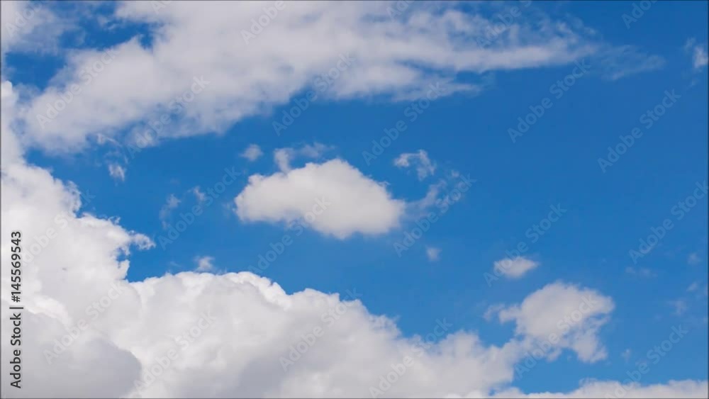 White clouds move across clear blue sky. Cloudy blue sky background. White clouds move across clear blue sky. Cloudy blue sky background.