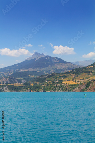 Panoramic view of the beautiful blue lago di Serre-Poncon in the alps
