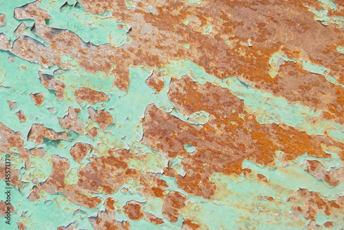 surface of rusty iron with remnants of old paint, chipped paint, texture background © uvisni
