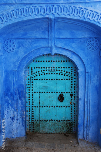 Ancient blue door in Chefchaouen medina, Morocco. © Anette Andersen
