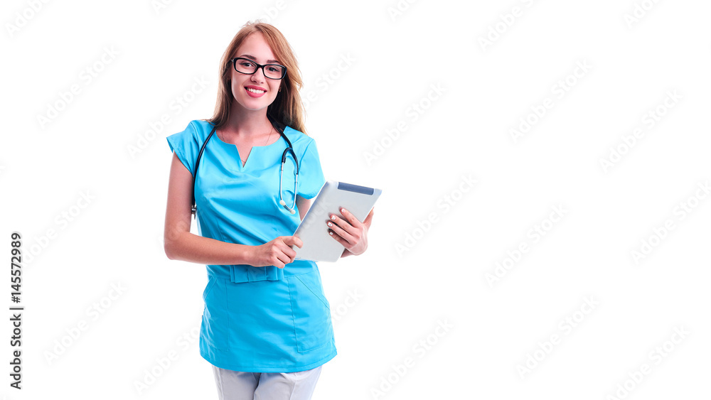 Female doctor using tablet computer in hospital lobby Female doctor using tablet computer in hospital lobby