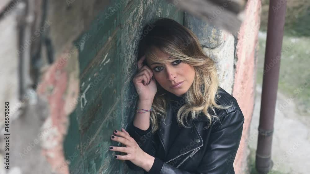 Portrait Of Pensive Sad blond Woman, Outdoors Portrait Of Pensive Sad blond Woman, Outdoors
