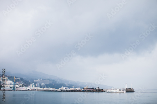 The promenade of Yalta. The port in the black sea. Cloudy weather on the black sea. The City Of Yalta- Crimea   © vadik02020