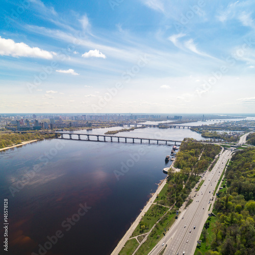Panoramic view of the city of Kiev in the spring. View of the Dnieper River and bridges across it. Aerial view, from above. Outdoor. © LALSSTOCK